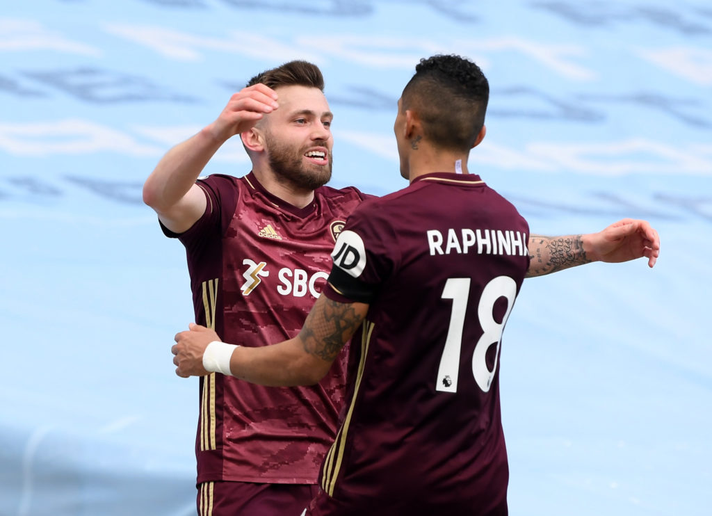 Raphina celebrating by hugging a teammate - mid-priced FPL midfielders