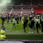 Man Utd v Liverpool kick-off delayed as protesting fans invade Old Trafford pitch
