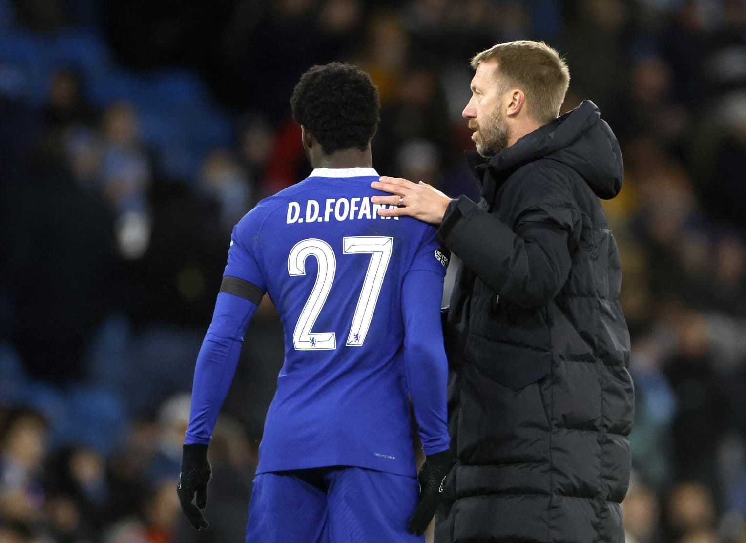  David Datro Fofana is consoled by Chelsea manager Graham Potter after being sent off during the match against Burnley in the Premier League.